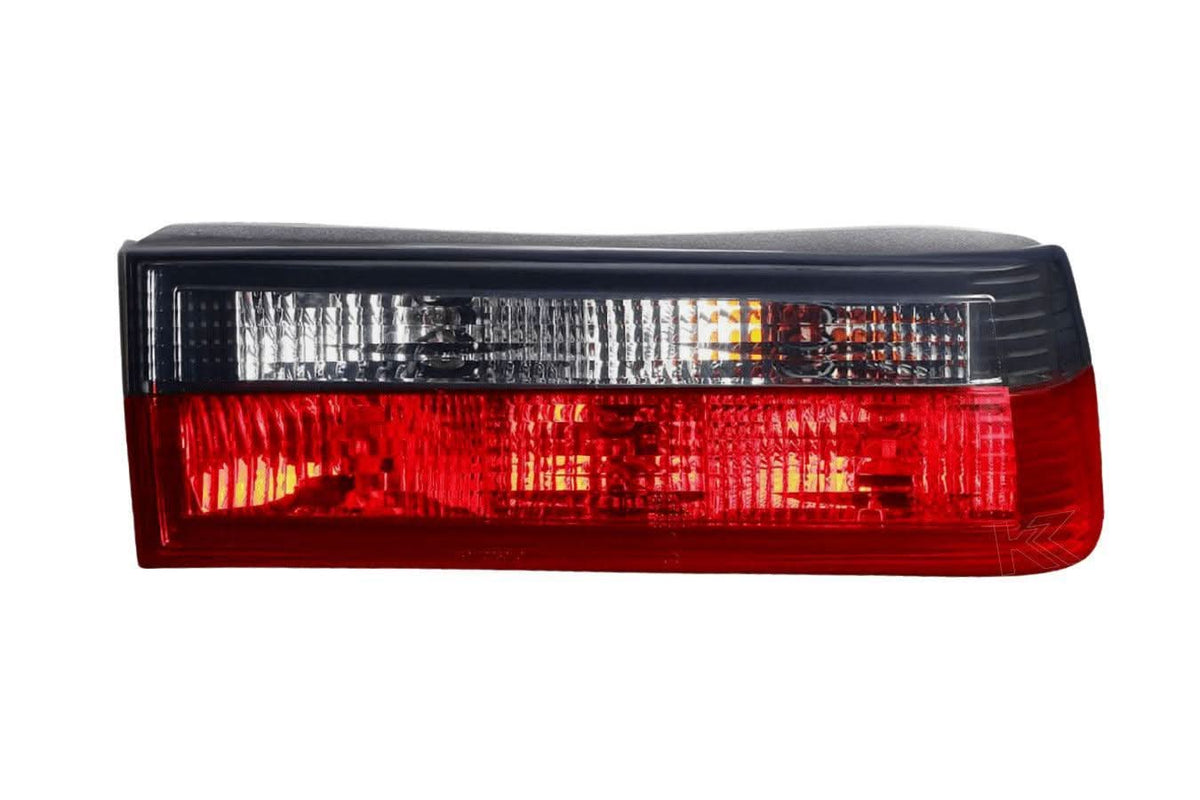 BMW 3-Series E30 pre-facelift red smoked tail lights by K2 Industries, showing the sleek design and smoke-tinted lens.