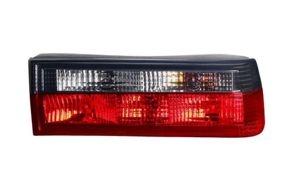 BMW 3-Series E30 pre-facelift red smoked tail lights by K2 Industries, showing the sleek design and smoke-tinted lens.