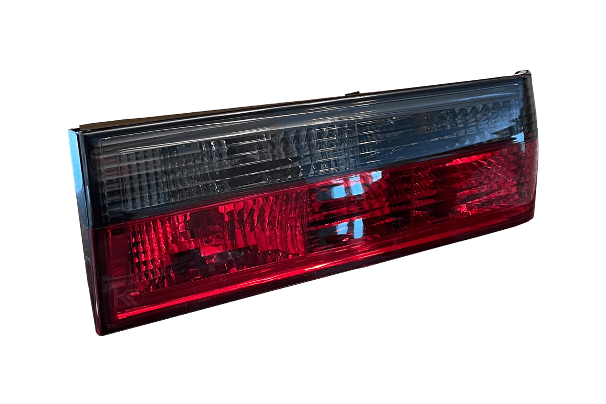 BMW 3-Series E30 pre-facelift tail lights in red smoked finish by K2 Industries, for models from 1982 to 1987.