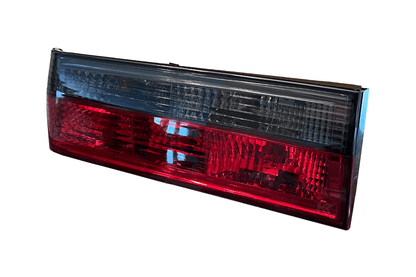 BMW 3-Series E30 pre-facelift tail lights in red and smoked finish by K2 Industries, for models 1982-1987.