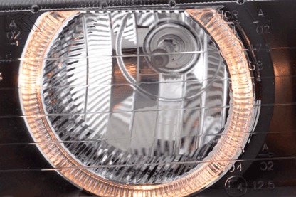 Black BMW 3-Series E36 coupe and convertible headlights with angel eye design, crafted by K2 Industries for 1992-1998 models.