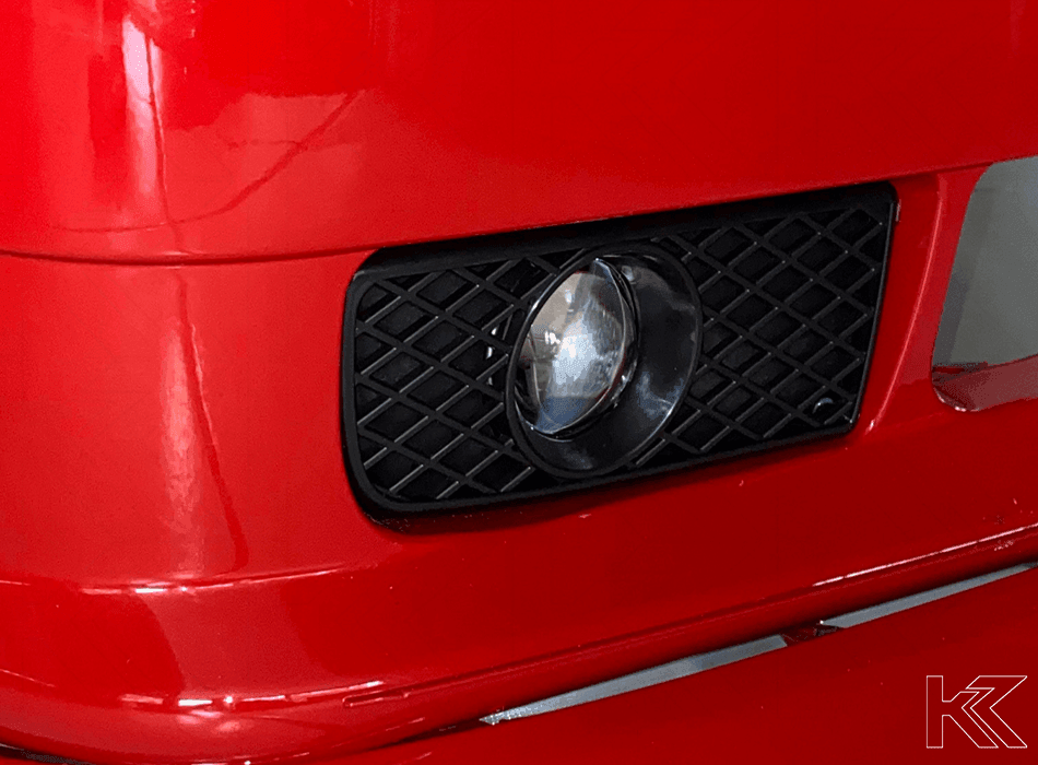 BMW 3-Series E36 EVO fog lights by K2 Industries, 1991-2000, showing pair of round fog lights with mounting brackets.