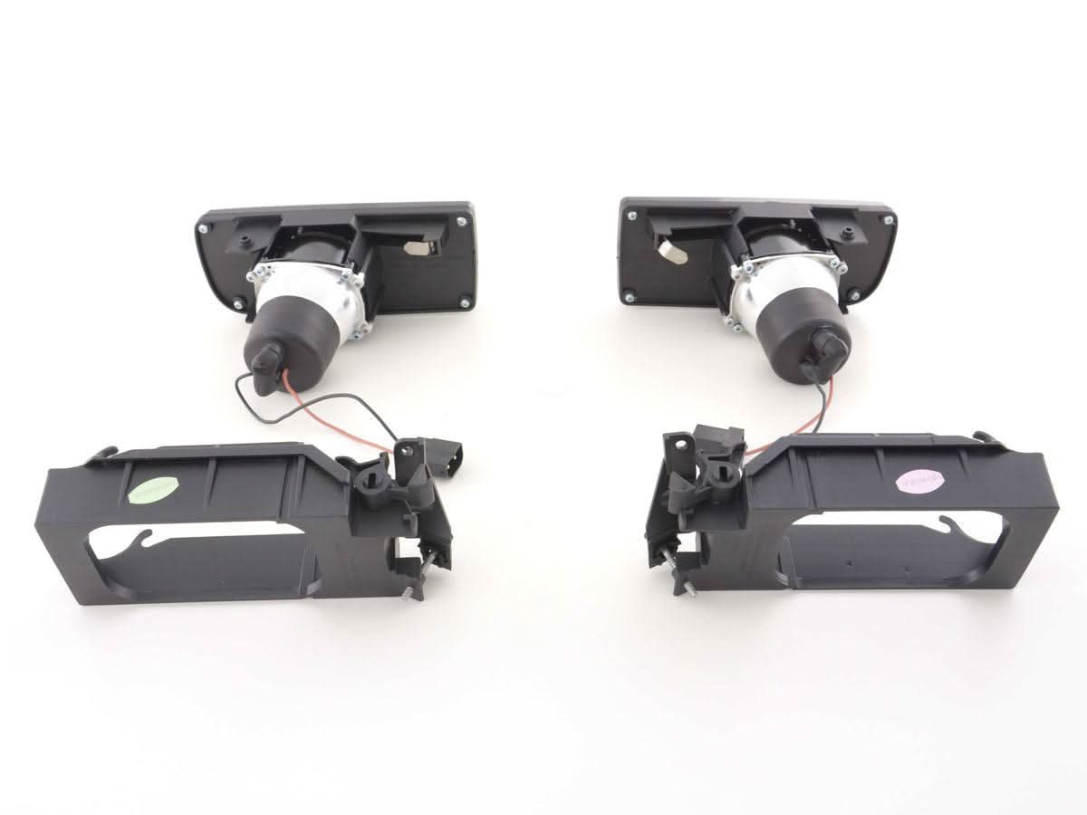 BMW 3-series E36 EVO fog lights by K2 Industries, 1991-2000, showing the sleek black housing and clear lenses for improved visibility.