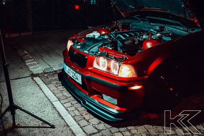 BMW 3 Series E36 sedan black angel eyes LED headlights by K2 Industries, designed for 1992-1998 models.
