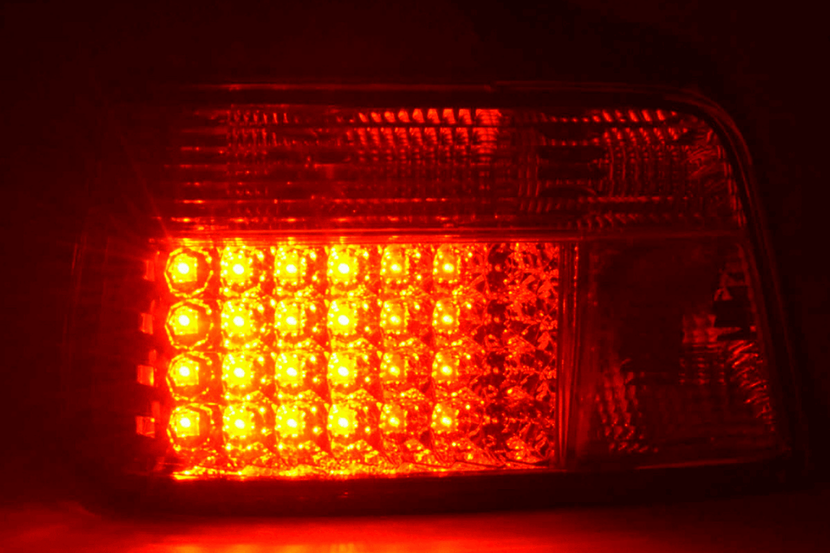 BMW 3-series E36 sedan chrome clear LED tail lights set by K2 Industries, showing the sleek tail light design for 1991-1998 models.