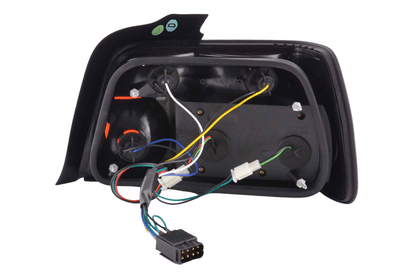 BMW 3-series E36 sedan chrome clear LED taillights set by K2 Industries, for 1991-1998 models, showing front and rear view.