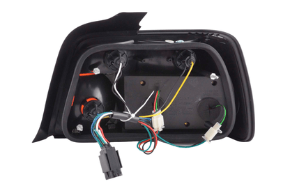 BMW 3-series E36 sedan red LED tail lights set by K2 Industries, compatible with 1991-1998 models, showing the rear lights.