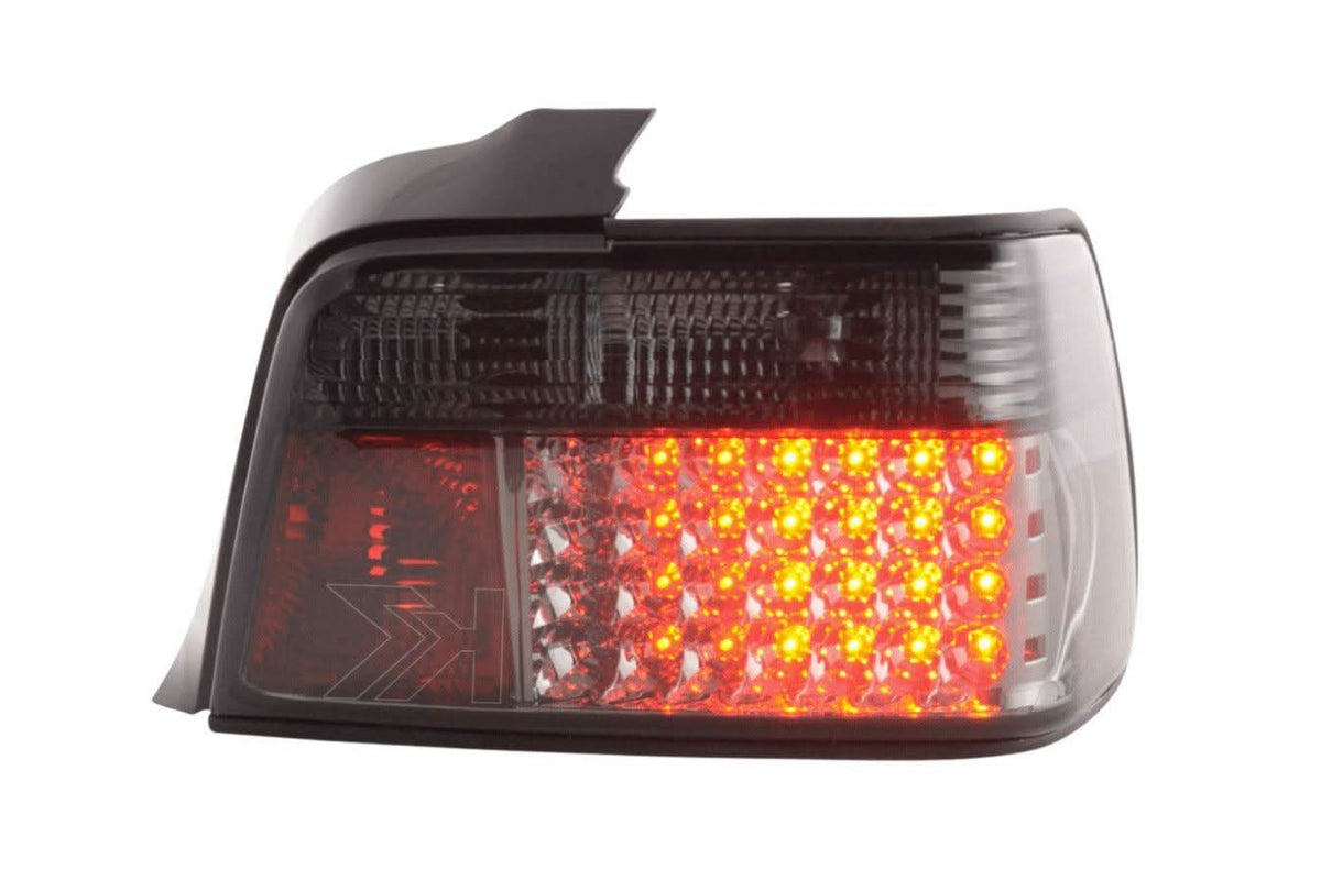 Smoked LED taillights set for BMW 3-series E36 sedan from K2 Industries, featuring sleek design and clear lens details.