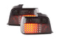 Smoked LED tail light set for BMW 3-series E36 sedan, 1991-1998, by K2 Industries, showing sleek, darkened rear lighting design.