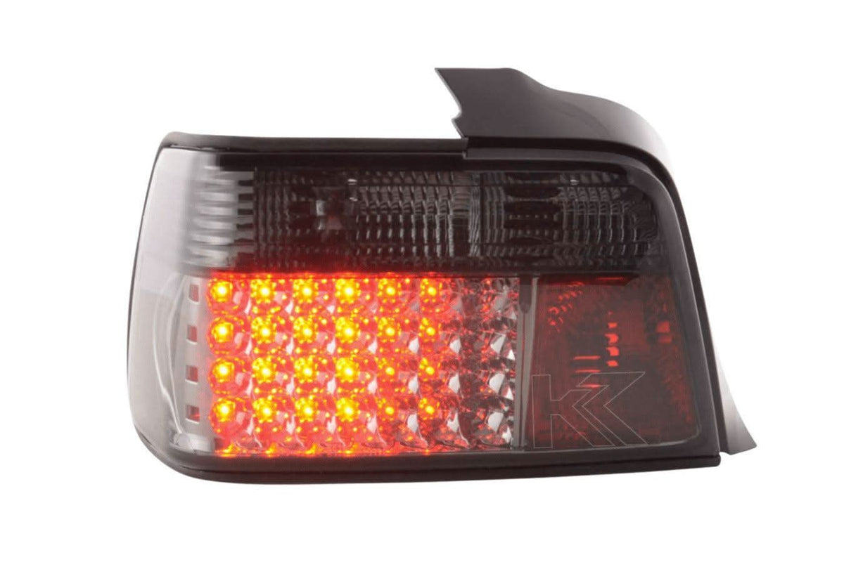 Set of smoked LED taillights for BMW 3-series E36 Sedan, 1991-1998, by K2 Industries, showing sleek, darkened rear lighting design.