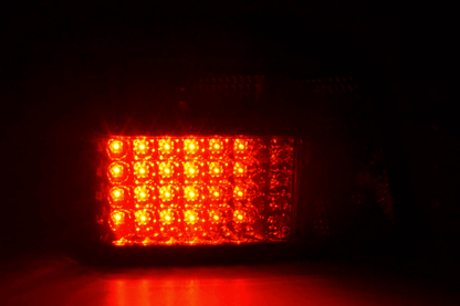 BMW 3-series E36 sedan smoked LED taillights set by K2 Industries, featuring sleek black lenses for 1991-1998 models.