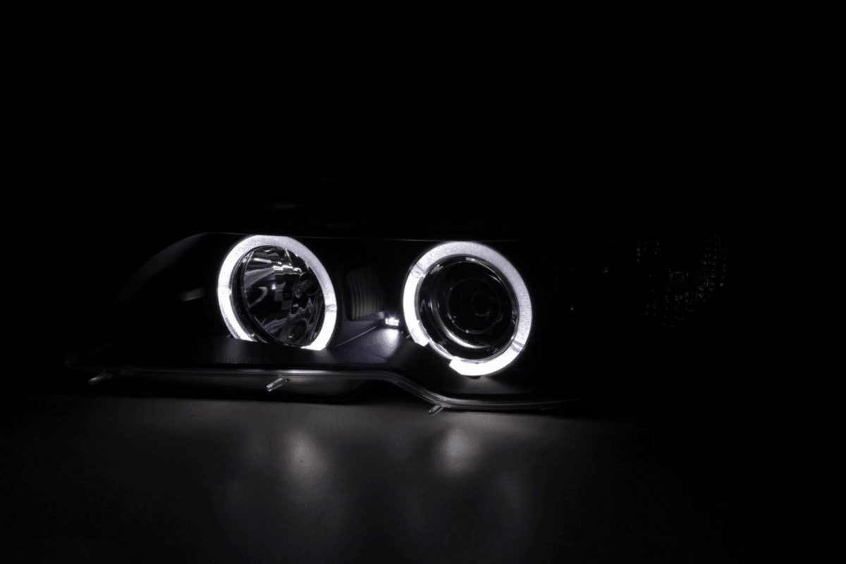 BMW 3-series E46 coupe/convertible black Xenon Angel Eyes headlights by K2 Industries, 2003-2005, with illuminated angel eye rings.