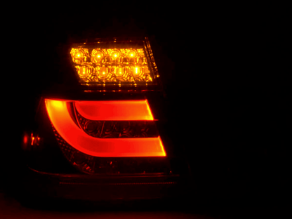 BMW 3-series E46 sedan red smoke LED tail lights set by K2 Industries, rear view showing sleek taillight design for 2002-2005.