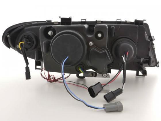 BMW 3-series E46 Sedan/Touring black angel eyes headlight set by K2 Industries, showing front view of headlights with black housing.