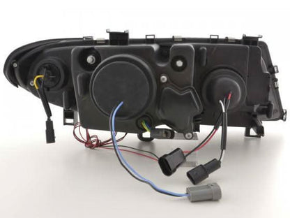 BMW 3-series E46 Sedan/Touring black angel eyes headlight set by K2 Industries, showing front view of headlights with black housing.