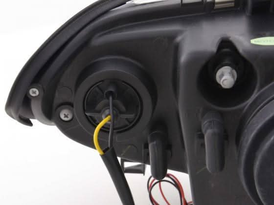 BMW 3 Series E46 sedan/touring black angel eyes headlights by K2 Industries, set of two with clear lenses and black housing.