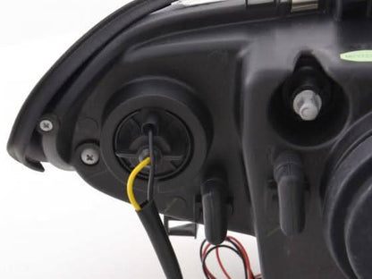 BMW 3 Series E46 sedan/touring black angel eyes headlights by K2 Industries, set of two with clear lenses and black housing.
