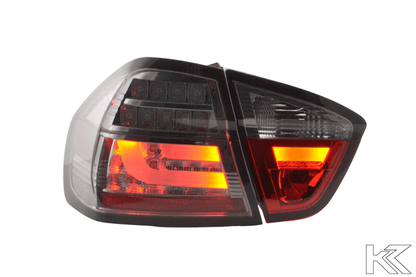 BMW 3-Series E90 sedan tail lights with chrome and smoked LED bar design, compatible with 2005-2008 models by K2 Industries.