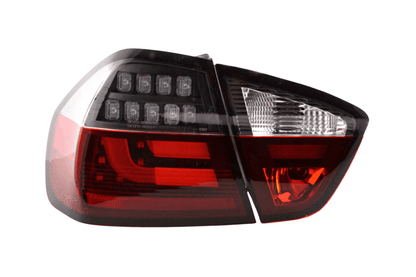 BMW 3-Series E90 sedan red and black LED taillights, 2005-2008, by K2 Industries showing close-up of illuminated tail light assembly.