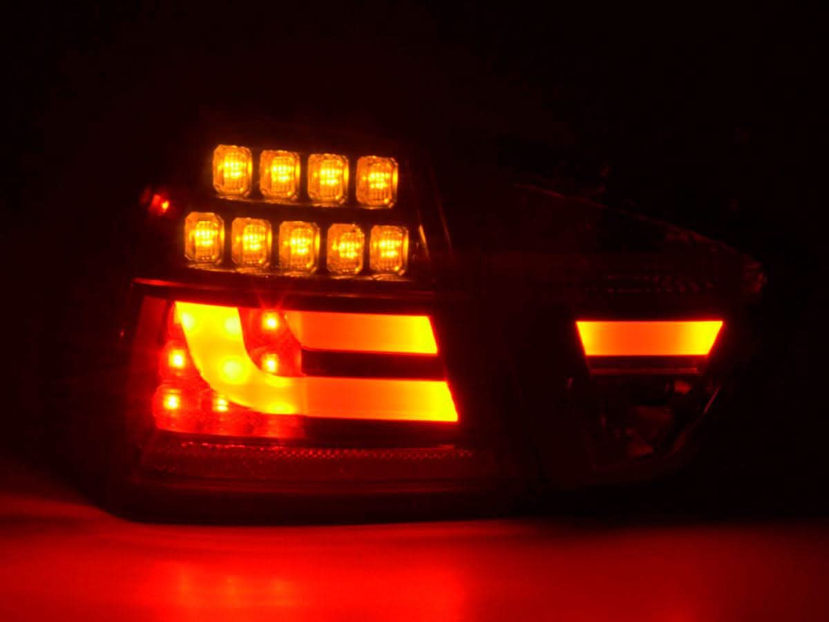 BMW 3-Series E90 sedan tail lights with red and black LED design by K2 Industries, for 2005-2008 model.