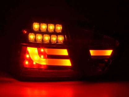 BMW 3-Series E90 sedan tail lights with red and black LED design by K2 Industries, for 2005-2008 model.