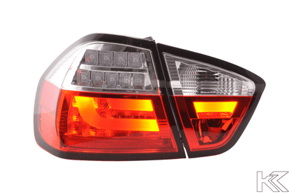 BMW 3-Series E90 sedan tail lights with red and clear LED bar design by K2 Industries, for model years 2005-2008.