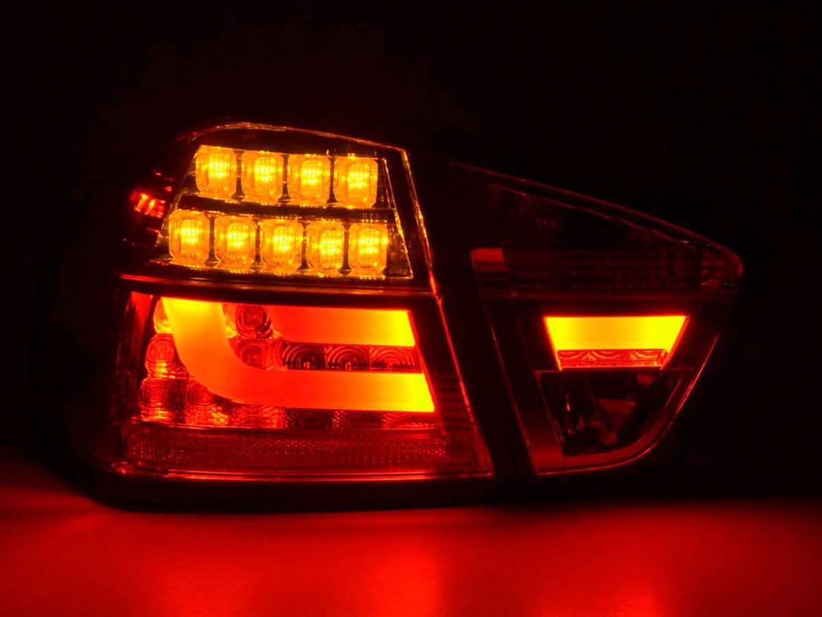 BMW 3-Series E90 sedan red and clear LED bar taillights by K2 Industries for 2005-2008 model years.