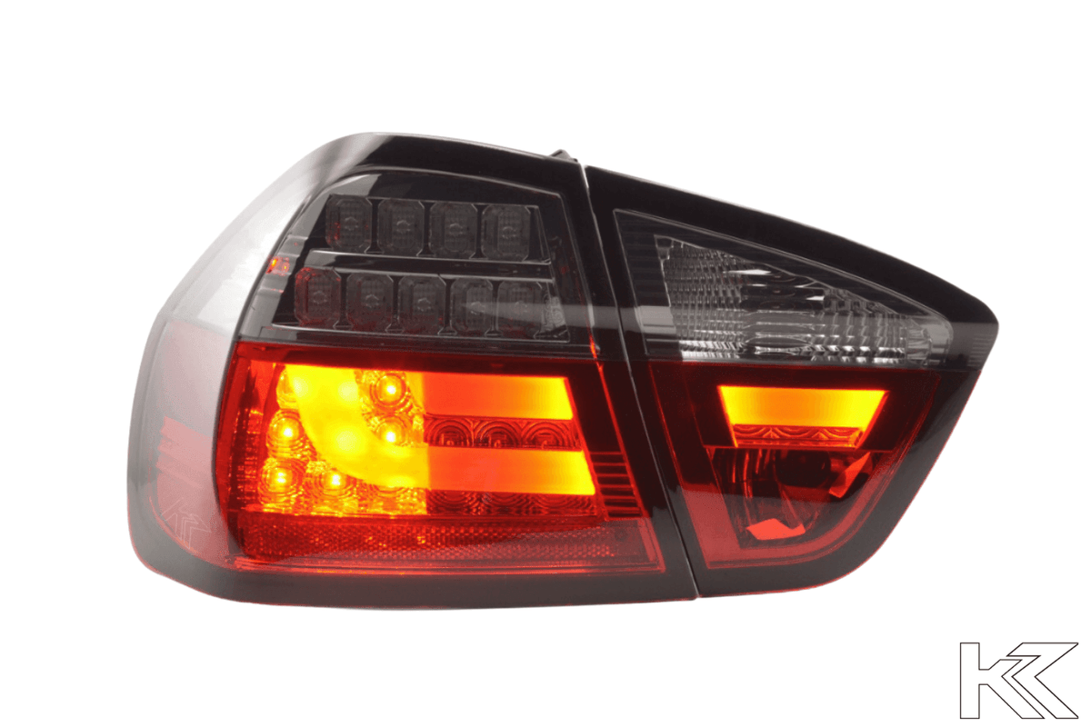BMW 3-Series E90 sedan red smoked LED bar tail lights, 2005-2008, by K2 Industries, showing sleek rear lighting design.