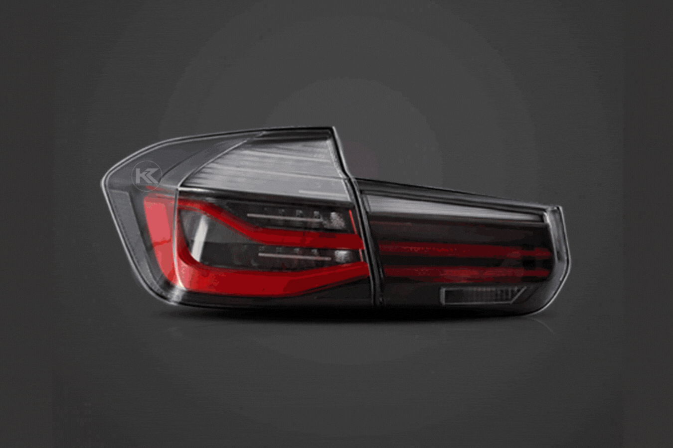 BMW 3-Series F30 F35 F80 6th Gen LCI style LED tail lights upgrade by K2 Industries showing red and clear lenses on a sedan.