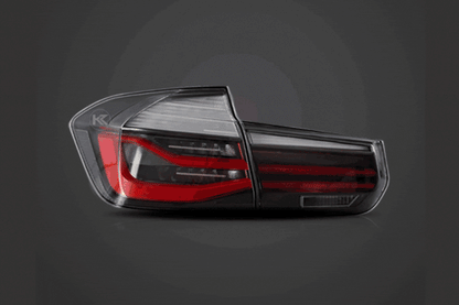BMW 3-Series F30 F35 F80 6th Gen LCI style LED tail lights upgrade by K2 Industries showing red and clear lenses on a sedan.