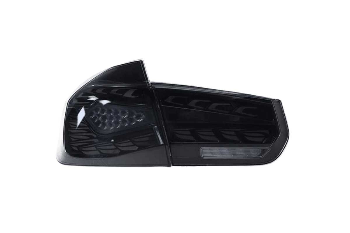 BMW 3 Series F30 F35 F80 black dragon scale LED tail lights by K2 Industries installed on a 2012-2019 model.