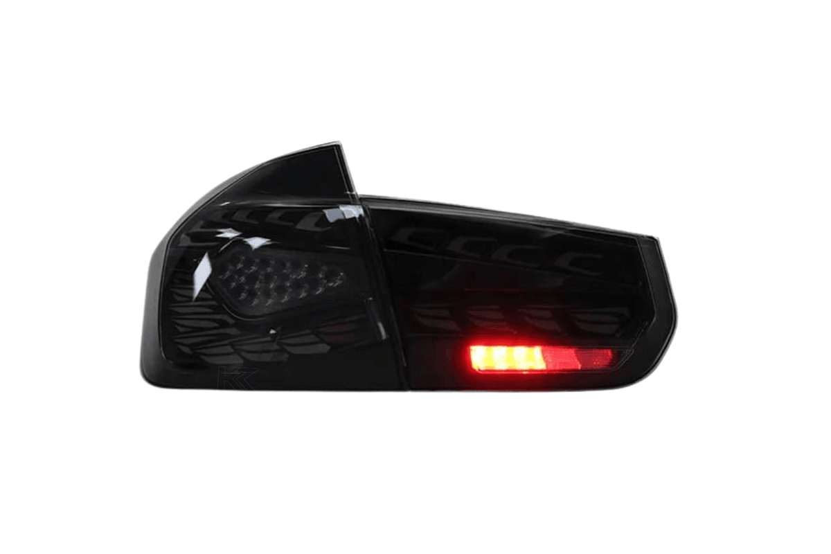 BMW 3 Series F30 F35 F80 Black Dragon Scale LED tail lights by K2 Industries, rear view showing sleek black design and LED detailing.