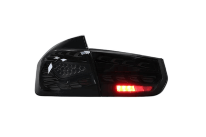 BMW 3 Series F30 F35 F80 Black Dragon Scale LED tail lights by K2 Industries, rear view showing sleek black design and LED detailing.