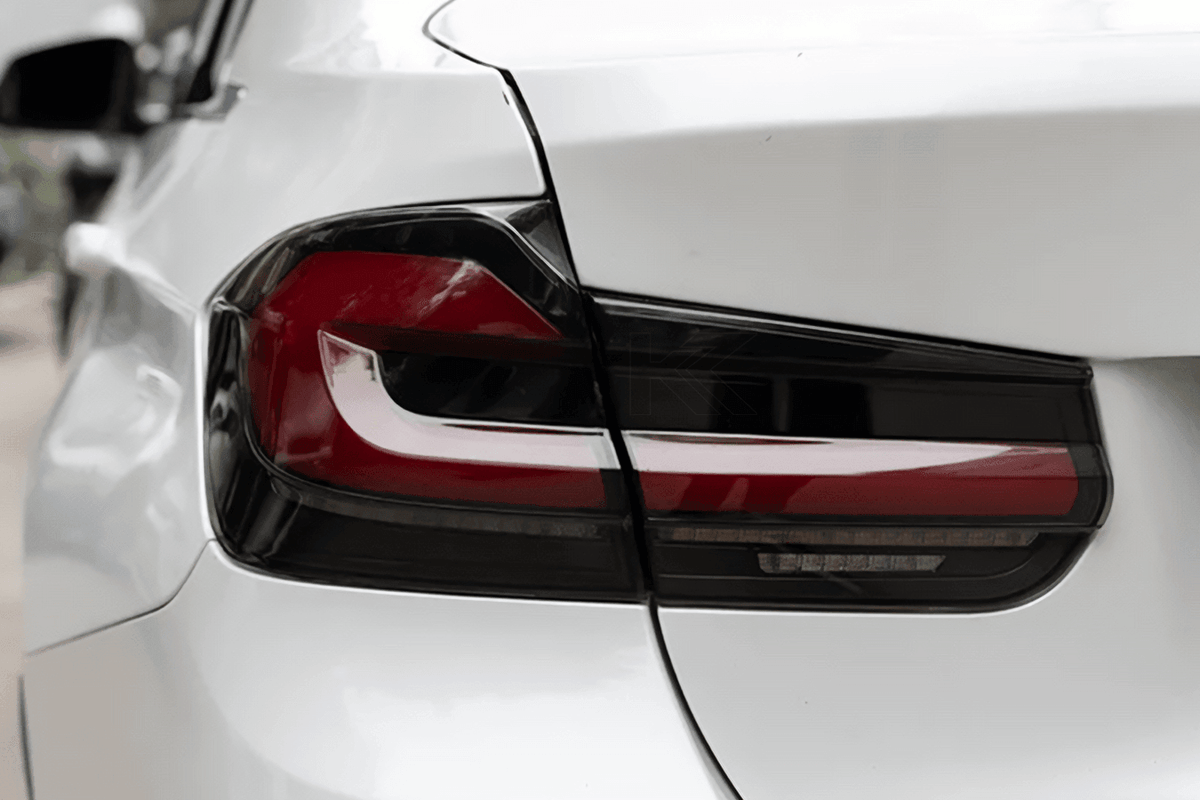 BMW 3 Series F30 F35 F80 LED tail light upgrade with modern black line design by K2 Industries, for 2012-2019 models.