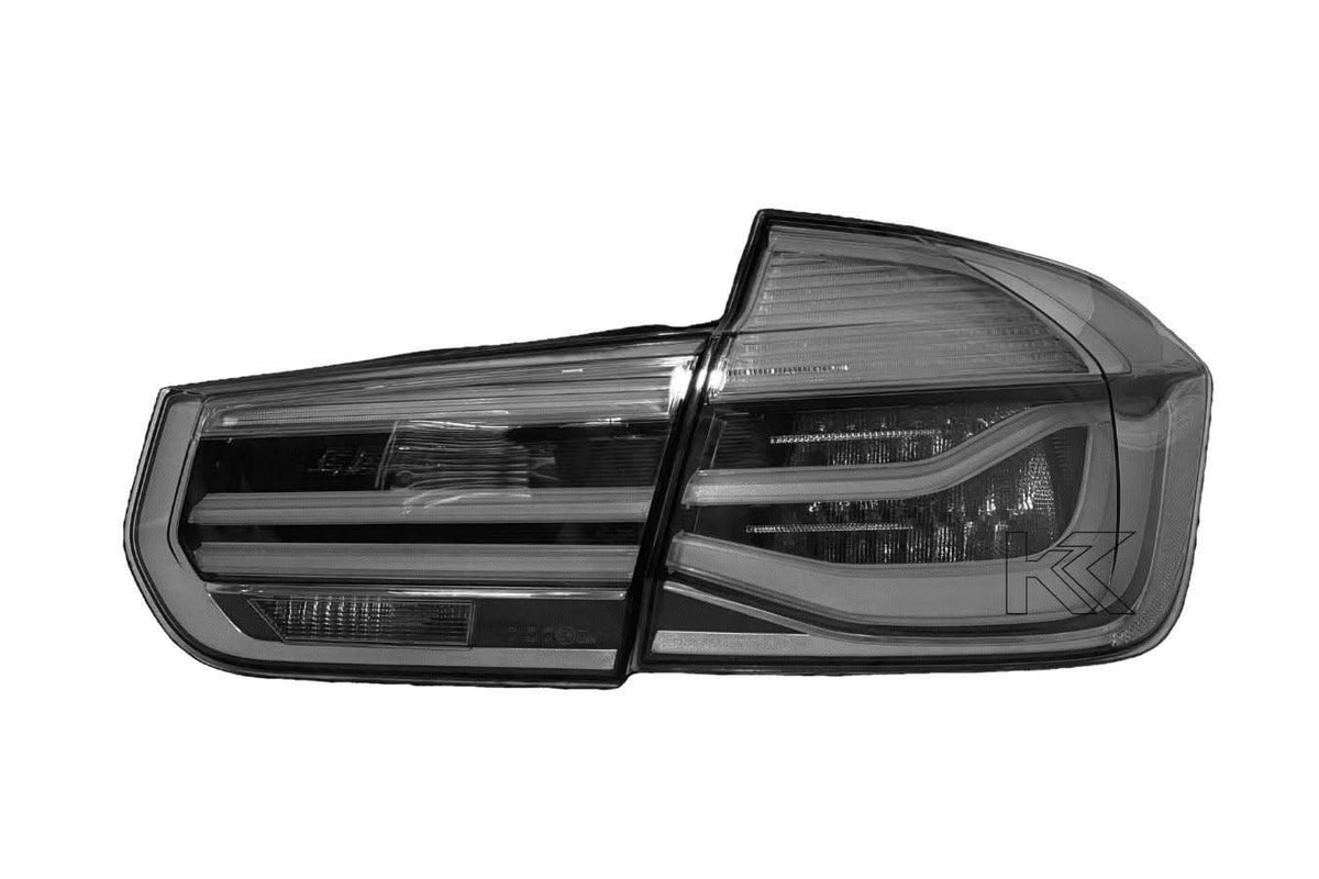 BMW 3-Series F30 F80 clear tail lights by K2 Industries, installed on a 2011-2020 model, showing sleek modern design.