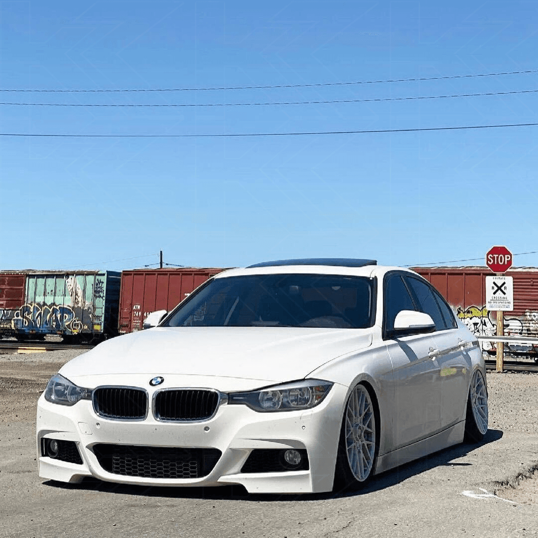 BMW 3-Series F30/F80 clear tail lights by K2 Industries installed on a 2011-2020 model, showcasing sleek, modern design.