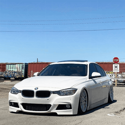 BMW 3-Series F30/F80 clear tail lights by K2 Industries installed on a 2011-2020 model, showcasing sleek, modern design.