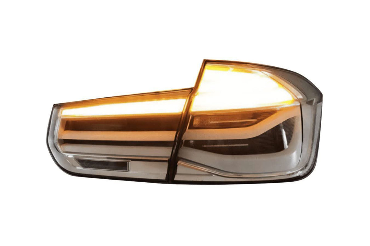 BMW 3-Series F30/F80 clear tail lights from K2 Industries, showing sleek transparent design for 2011-2020 models.