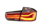 BMW 3-Series F30/F80 clear tail lights installed on a 2011-2020 model, showcasing sleek, modern design by K2 Industries.