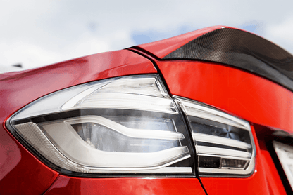 BMW 3-Series F30/F80 clear tail lights installed on a car, showing sleek, modern design for 2011-2020 models by K2 Industries
