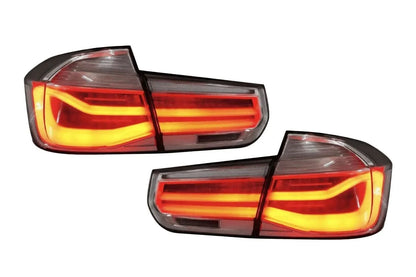 BMW 3-Series F30/F80 clear tail lights by K2 Industries, showing sleek design and bright LED illumination for model years 2011-2020.