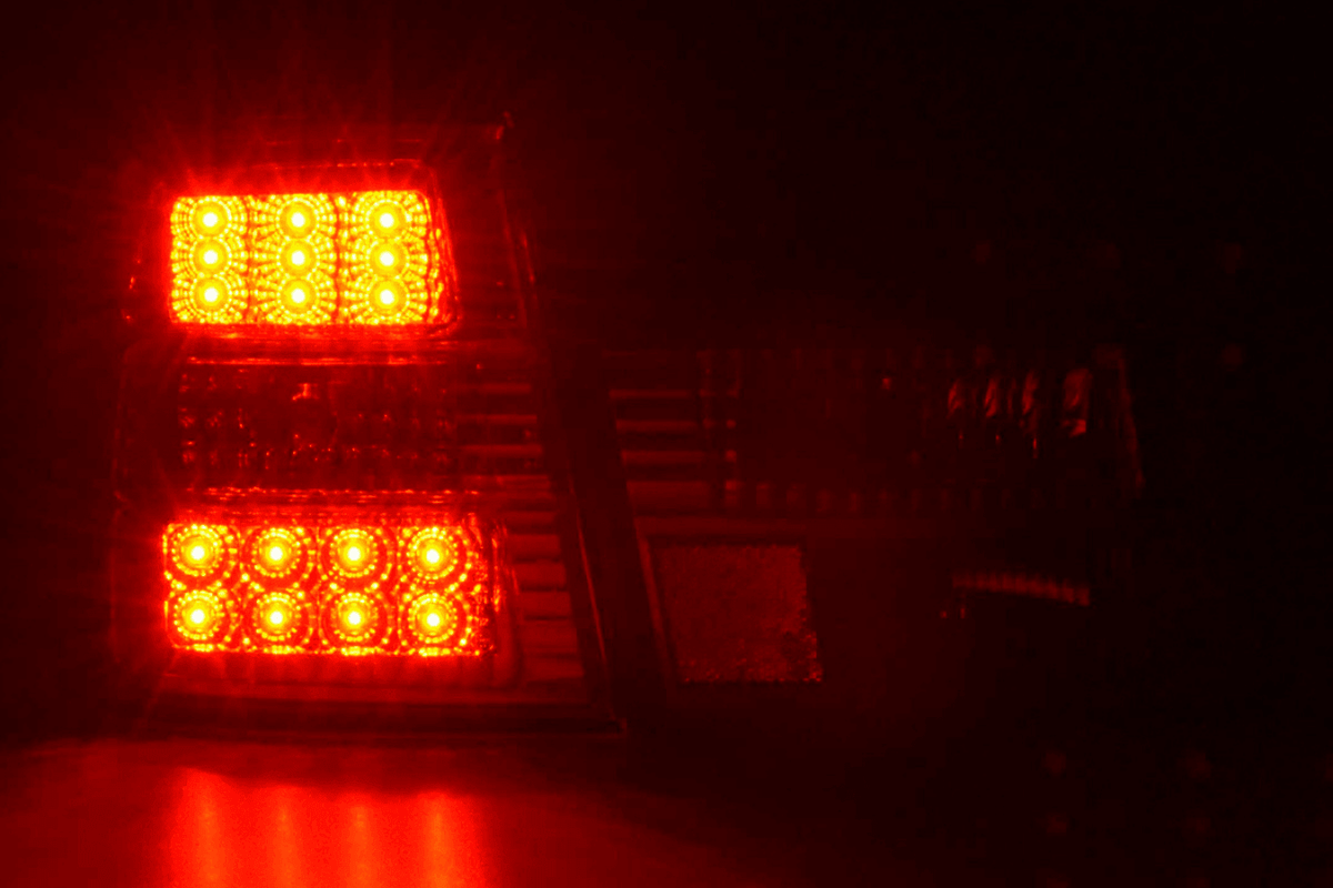 BMW 5-Series E34 chrome clear LED tail lights set by K2 Industries, showing sleek design and bright LED illumination.