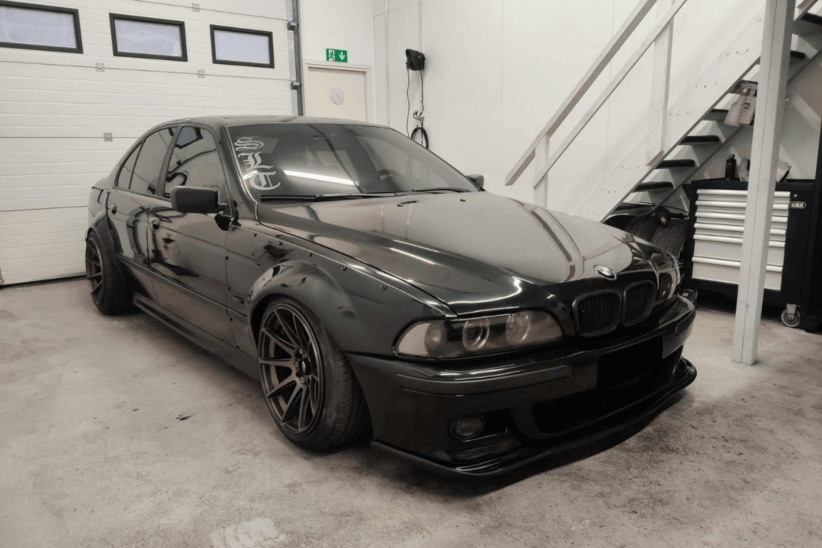 BMW 5-Series E39 sedan full over fender kit by K2 Industries, showing the set of wide over fenders for 1996-2003 models.