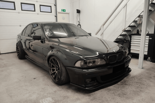 BMW 5-Series E39 sedan full over fender kit by K2 Industries, showing the set of wide over fenders for 1996-2003 models.