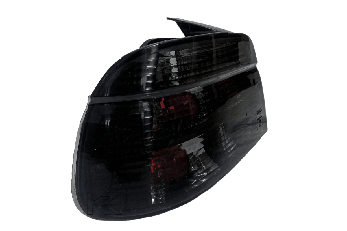 BMW 5 Series E39 smoked tail lights by K2 Industries, showing the dark-tinted rear light assembly for 1995-2000 models.