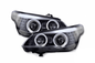 BMW 5-series E60 E61 black angel eyes headlight set by K2 Industries, for models 2003-2007, showing the headlights with angel eye rings.
