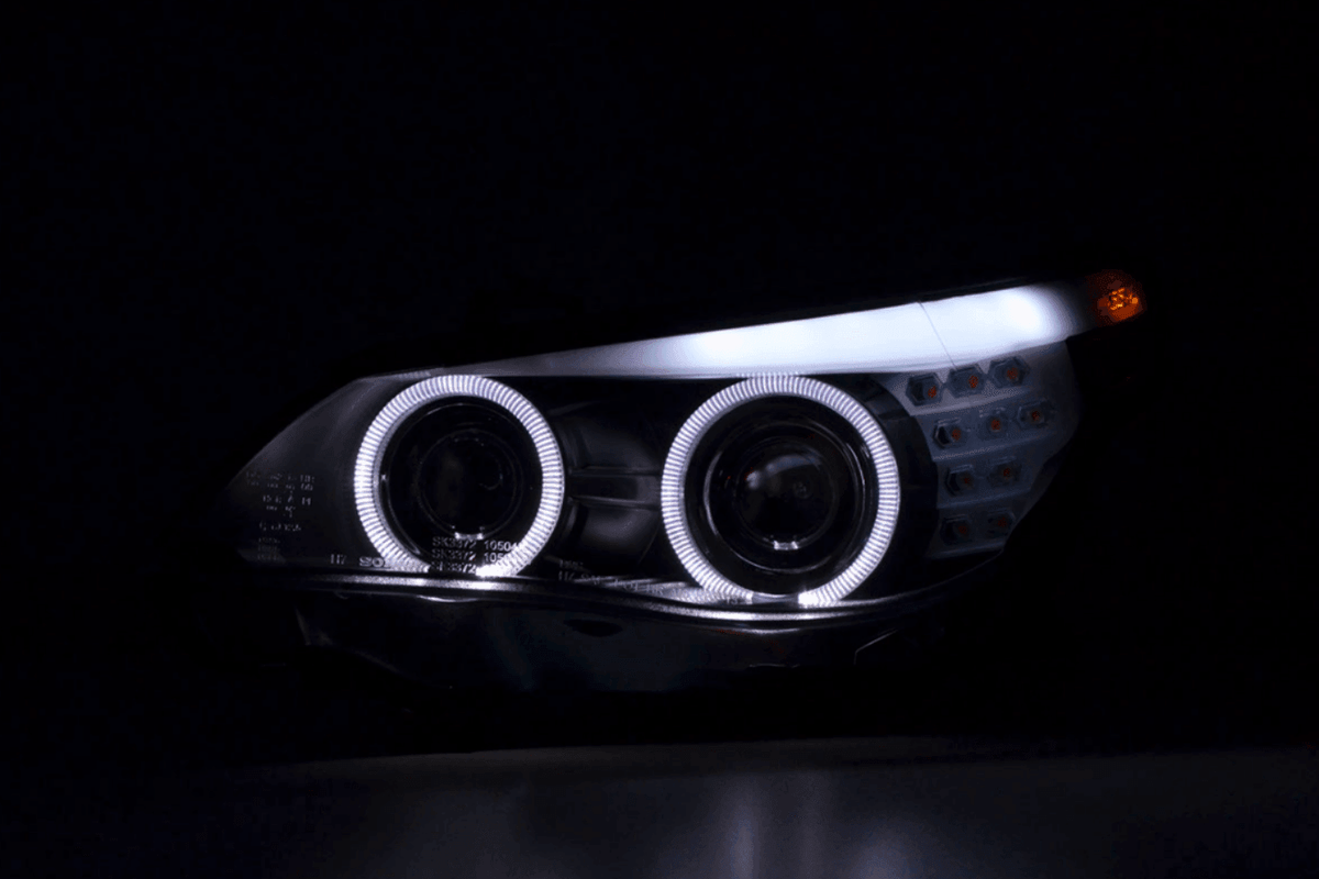 BMW 5-series E60 E61 black angel eyes headlights set by K2 Industries, 2003-2007, showing front view with clear lenses.