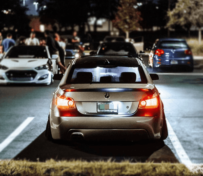 BMW 5-series E60 sedan chrome clear LED taillights set by K2 Industries, showing front and rear view with chrome finish and LED details.