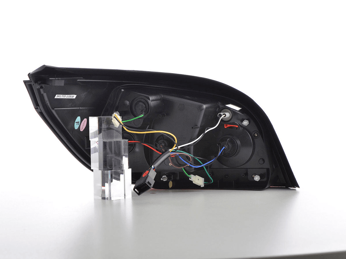BMW 5-Series E60 sedan red and smoke LED tail lights by K2 Industries, for 2007-2009 model year, visible on the vehicle.