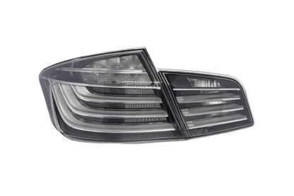 BMW 5-Series F10 clear style LED tail lights by K2 Industries, showing sleek, transparent lens design for 2010-2017 models.
